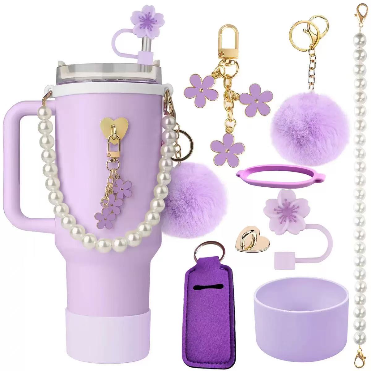Aesthetic tumbler accessory bundle with pearl strap, fluffy pom-pom keychain, flower straw topper, silicone cup boot, and decorative charms for stylish drinkware customization.