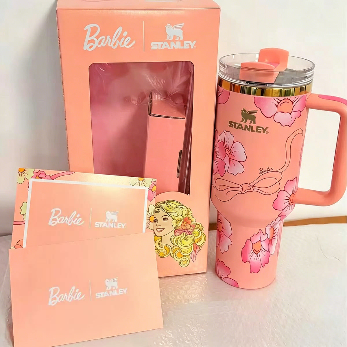 Stanley 40oz insulated tumbler with Barbie floral design, pink background, matching gift box and pink handle
