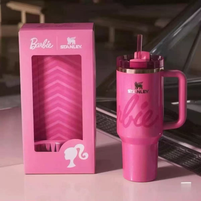 Stanley 40oz insulated tumbler with Barbie logo and pink design, matching Barbie-themed gift box and pink straw handle