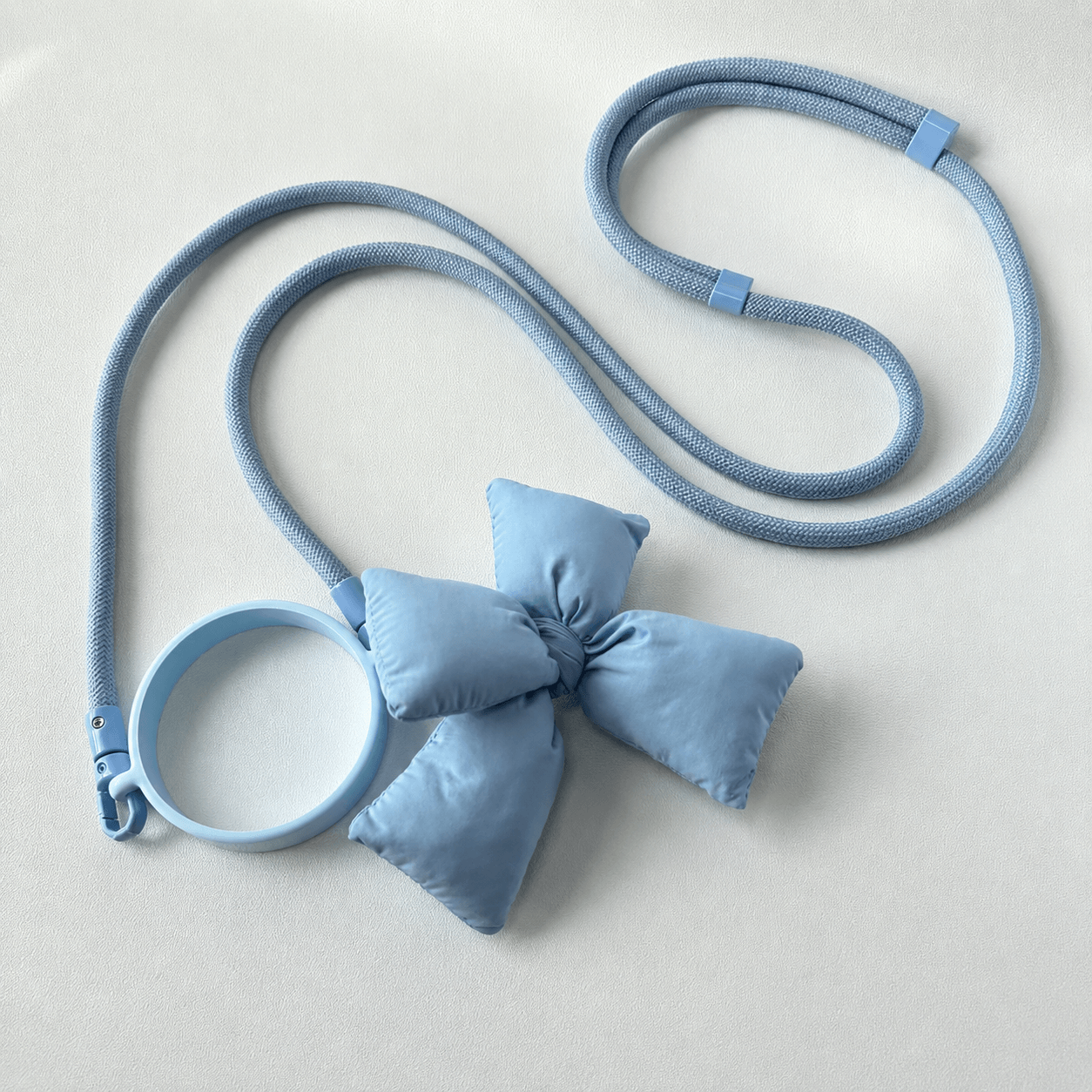 Blue dog leash and collar set on a light gray background
