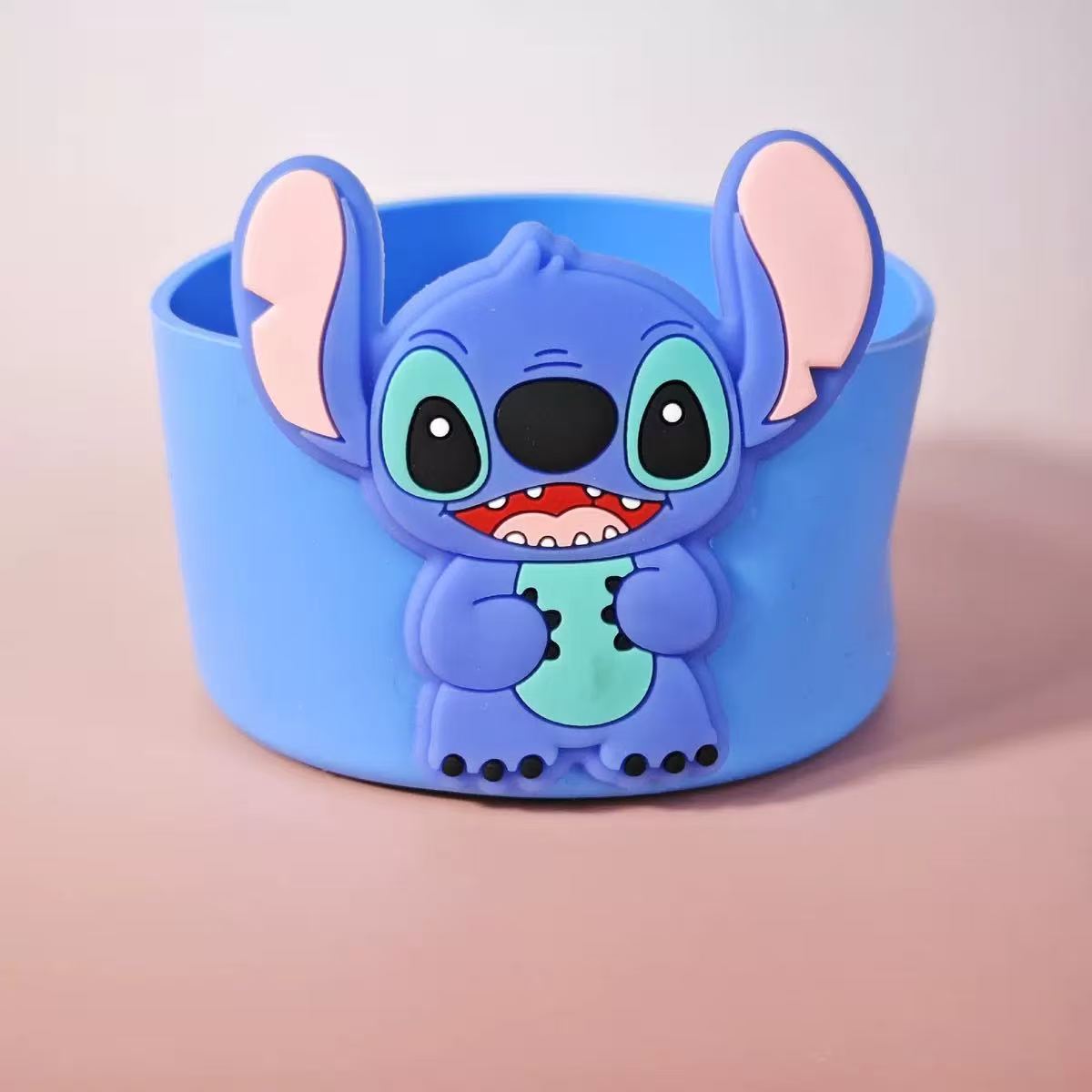 Blue wristband with cartoon character on a pink background