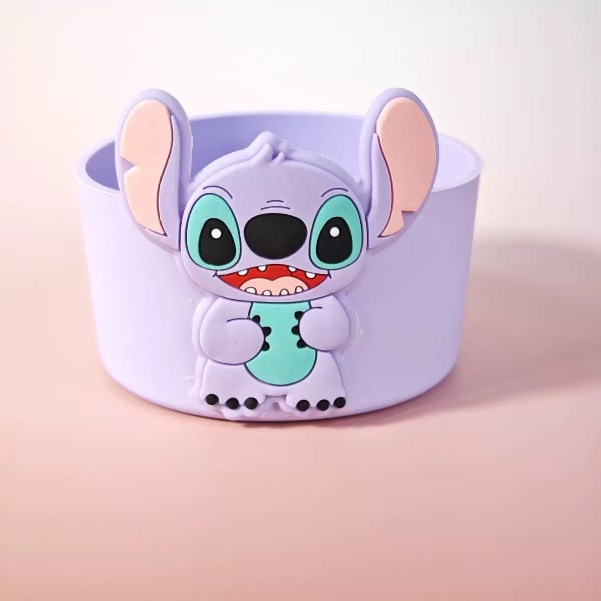 Cartoon character wristband on a light pink background