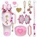 Collection of pink accessories including  keychains, and decorative items on a white background.