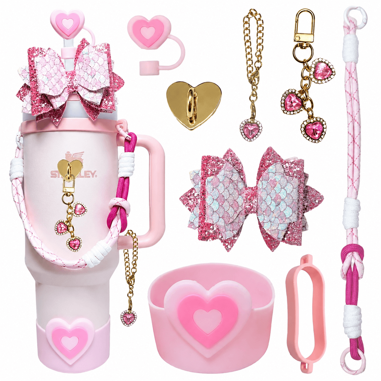Collection of pink accessories including  keychains, and decorative items on a white background.