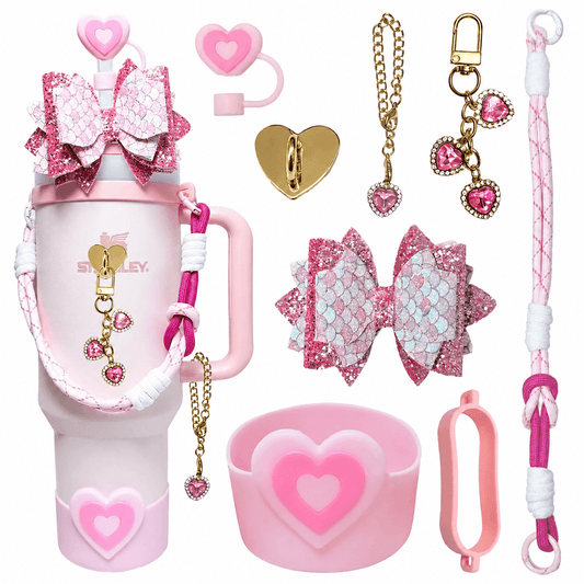 Collection of pink accessories including  keychains, and decorative items on a white background.