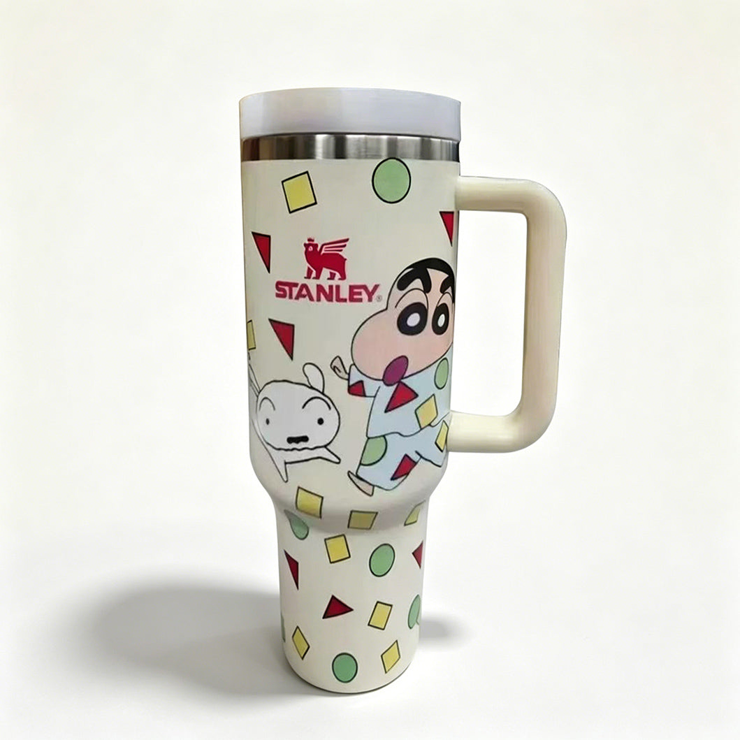 Stanley 40oz insulated tumbler with Crayon Shin-chan design, playful cartoon characters, and colorful geometric shapes, white handle