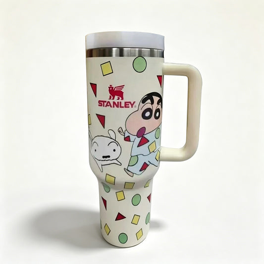 Stanley 40oz insulated tumbler with Crayon Shin-chan design, playful cartoon characters, and colorful geometric shapes, white handle