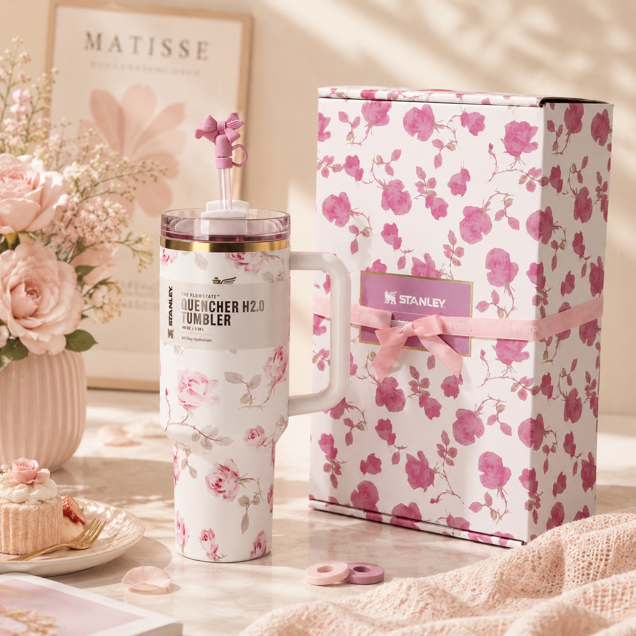 Floral-themed tumbler with matching packaging on a decorative table.