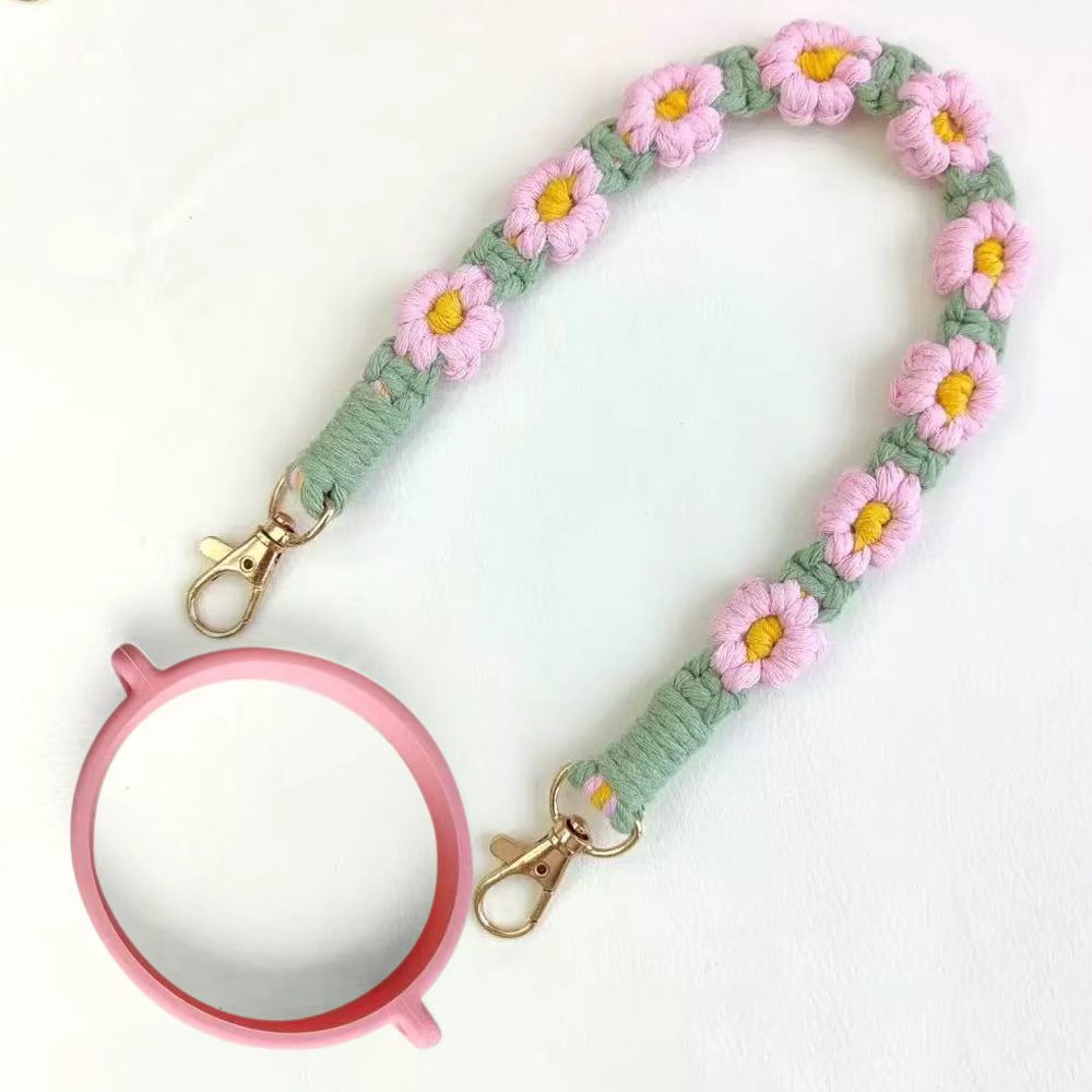 Floral lanyard with a pink mirror on a white background