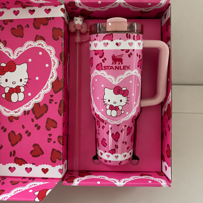 Stanley 40oz insulated tumbler with Hello Kitty heart design, pink background, matching gift box, pink handle