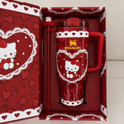 Stanley 40oz insulated tumbler with Hello Kitty heart design, pink background, matching gift box, pink handle