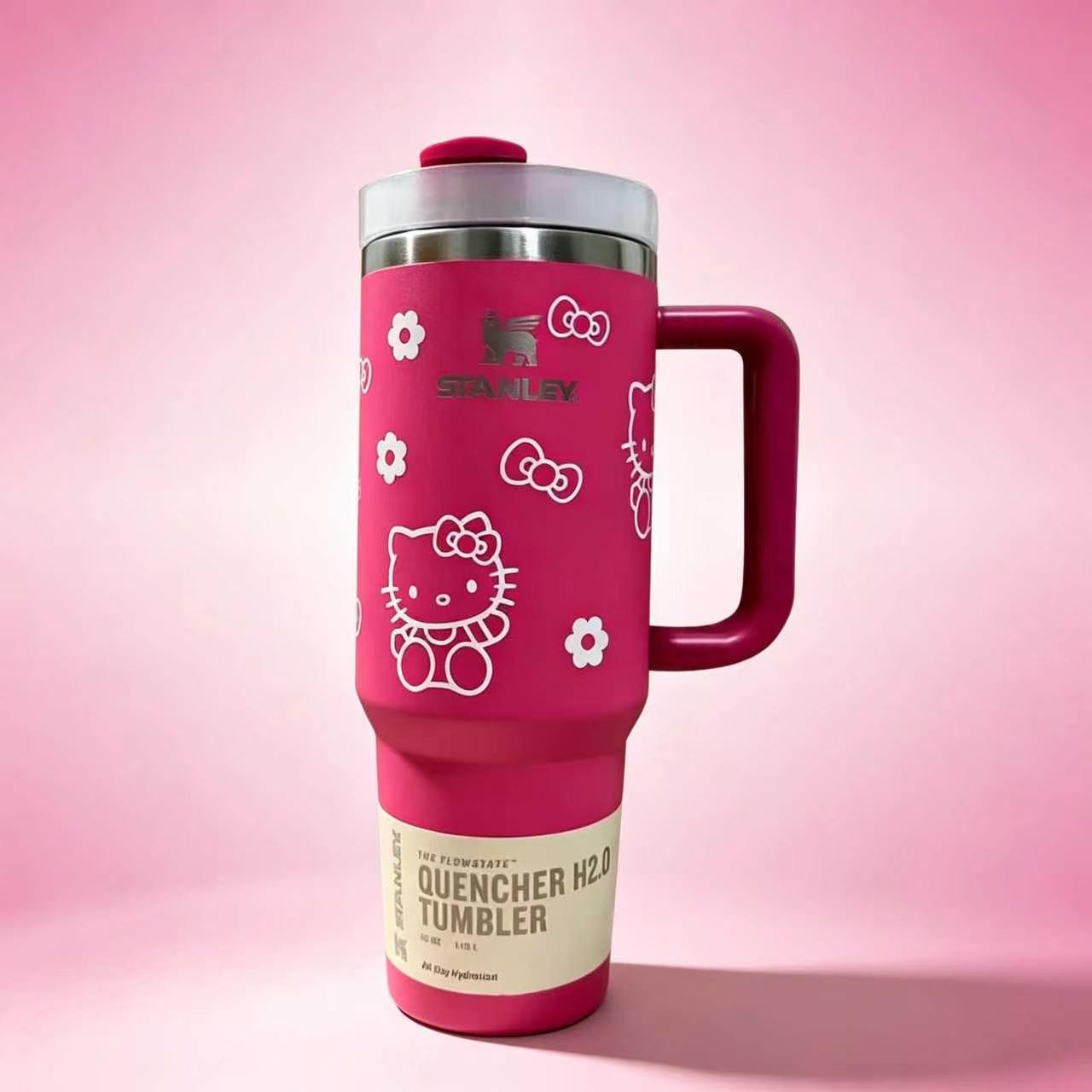 Stanley 40oz insulated tumbler with Hello Kitty illustrations, pink background, red handle, and cute floral accents