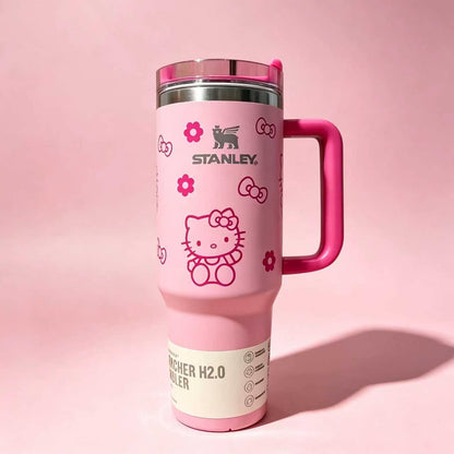 Stanley 40oz insulated tumbler with Hello Kitty illustrations, pink background, red handle, and cute floral accents