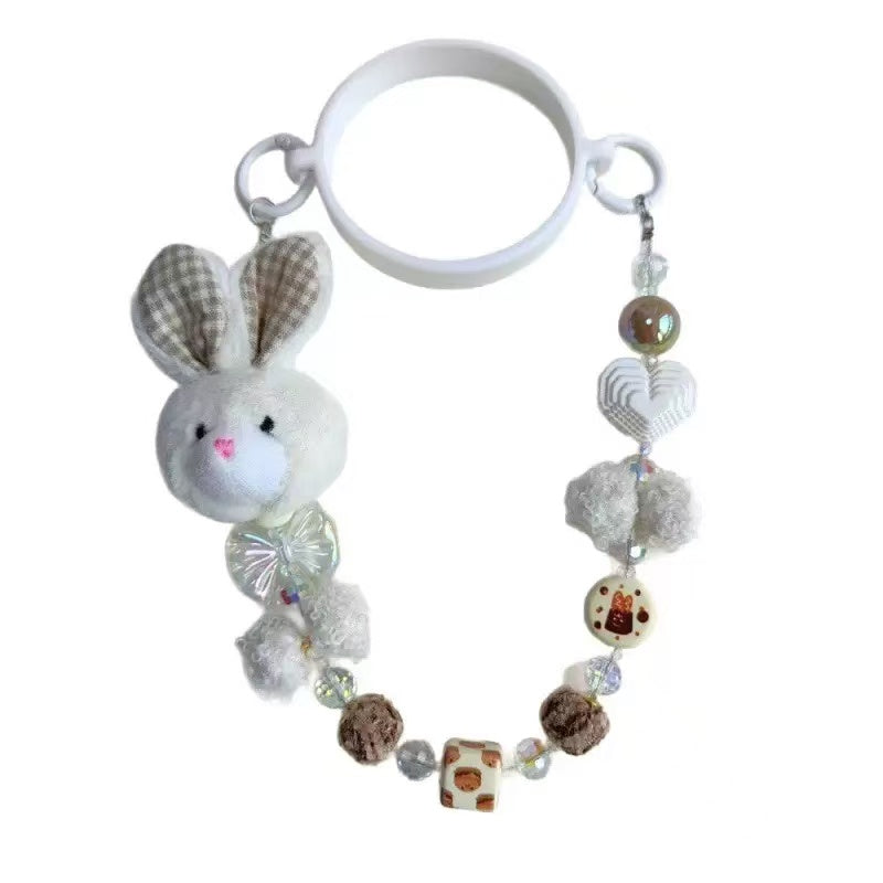 Keychain with a rabbit charm and bead decorations on a white background