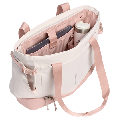 Pink and white backpack with compartments on a white background