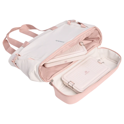 Pink and white jewelry case with a strap on a white background