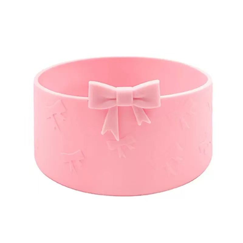 Pink bowl with a bow on a white background