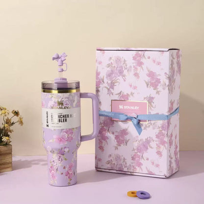 Purple and pink floral Stanley 40oz insulated tumbler with straw and matching gift box, elegant rose pattern design
