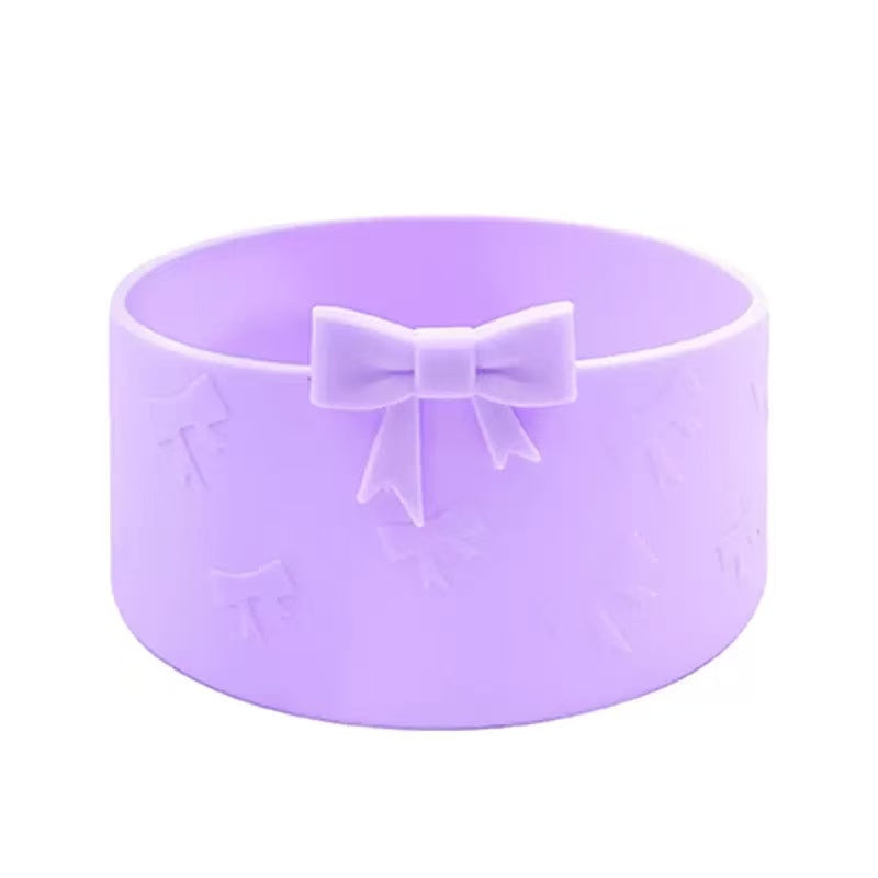 Purple silicone mold with bow design on a white background