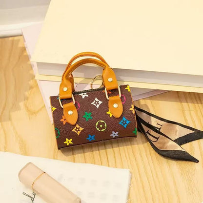 Small brown handbag with colorful pattern on a wooden surface