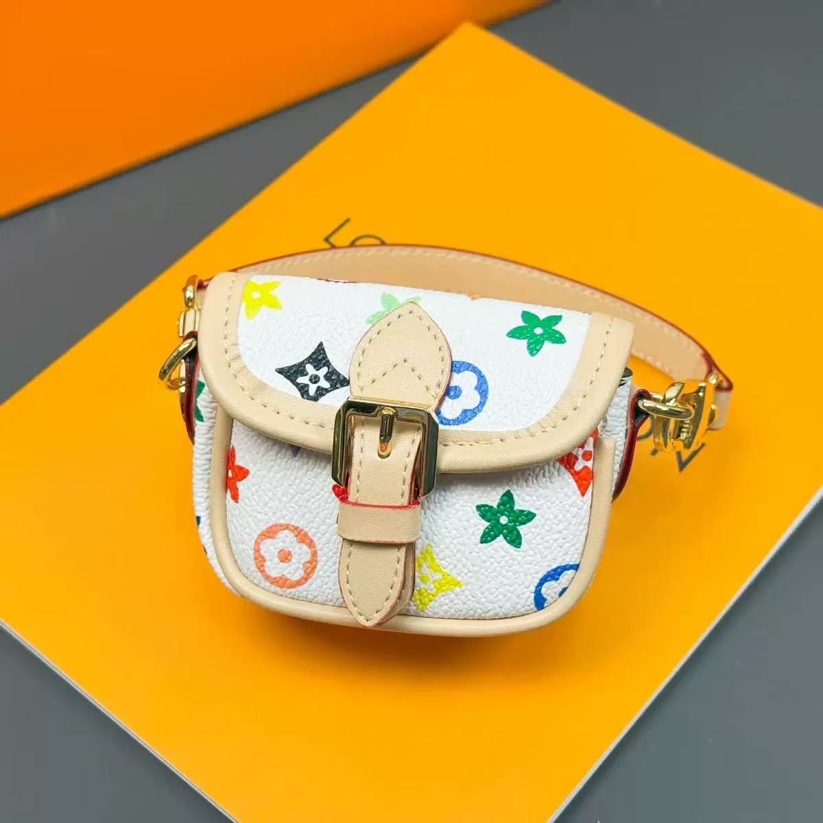 Small handbag with colorful patterns on a multicolored background