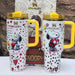 Snoopy Stanley 40oz insulated tumbler set with yellow handle and lid, holding hearts, includes matching Peanuts gift box