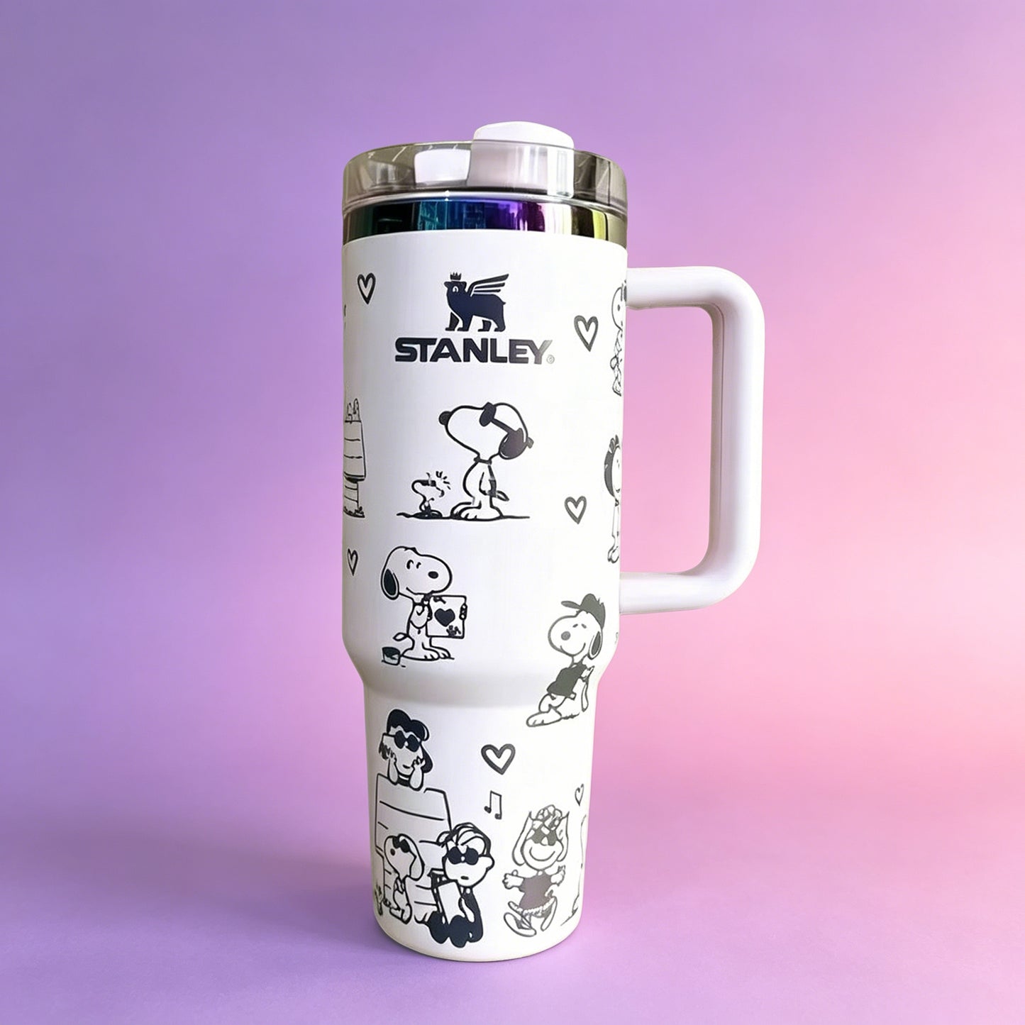 Stanley 40oz insulated tumbler with Snoopy and Woodstock illustrations, hearts and playful icons, white ergonomic handle