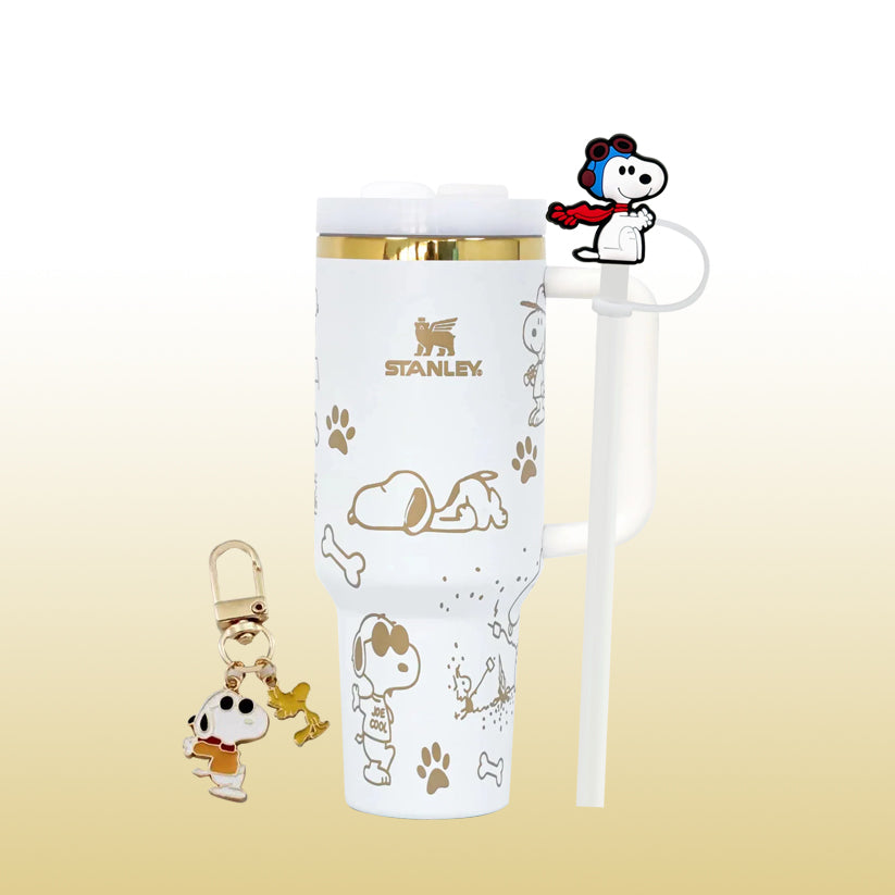 Stanley 40oz insulated tumbler featuring Snoopy dog illustrations, paw prints and bones