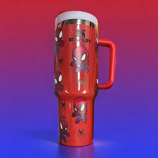 Stanley 40oz insulated tumbler featuring Spider-Man comic artwork, red glitter background and red ergonomic handle