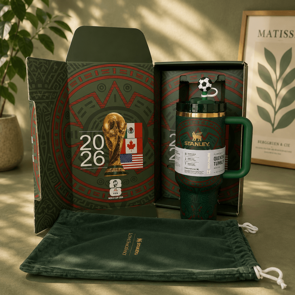 Stanley mug with packaging and accessories on a table