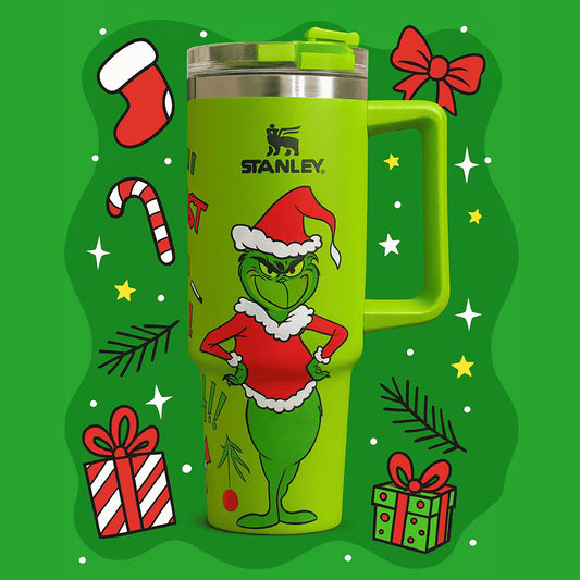 Stanley 40oz insulated tumbler featuring c background, holiday gift illustrations and green ergonomic handle
