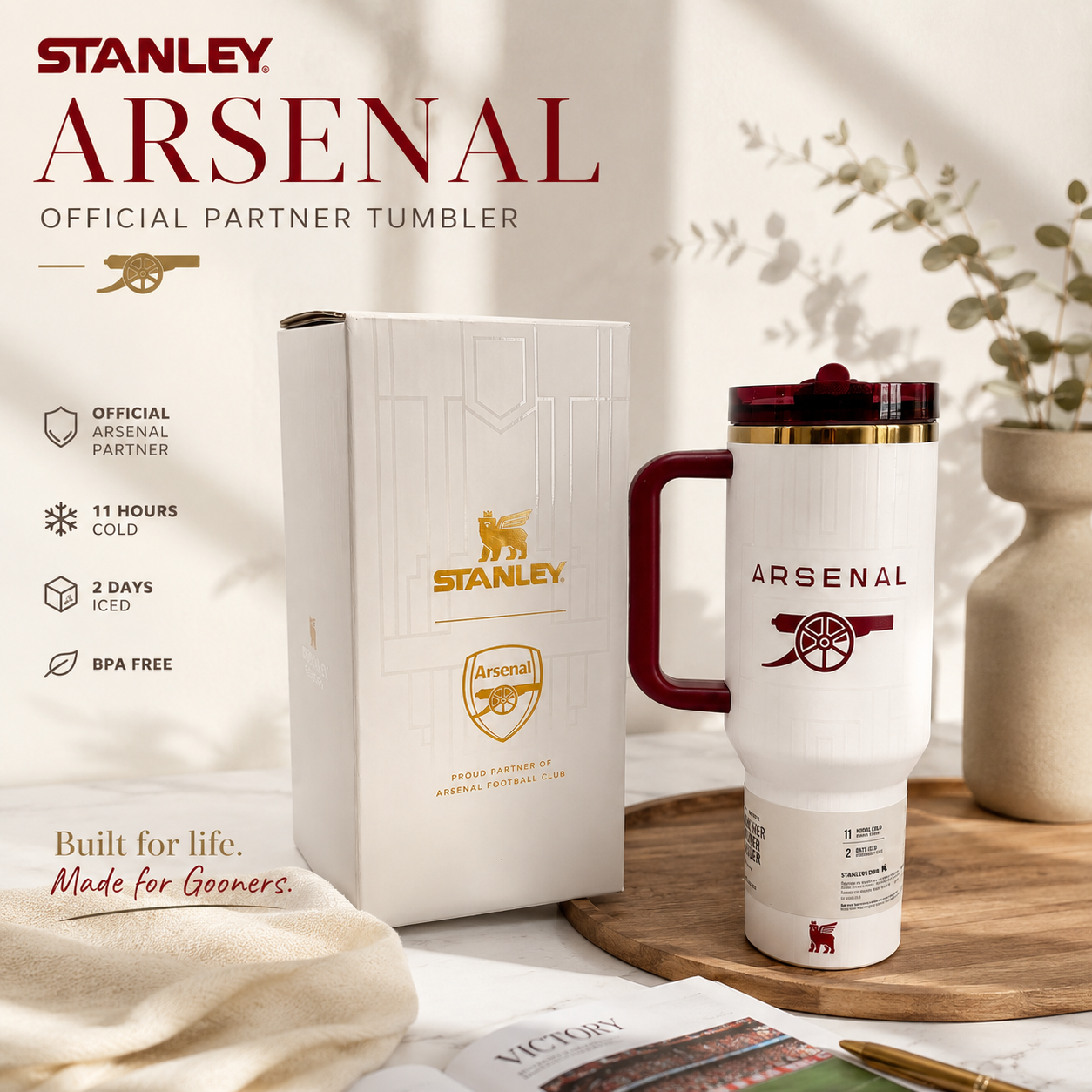 Stanley Arsenal tumbler with packaging on a decorative surface