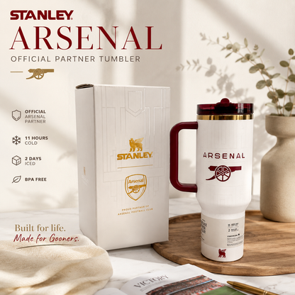 Stanley Arsenal tumbler with packaging on a decorative surface