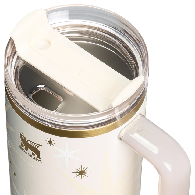 Stanley mug with handle and clear lid on a white background