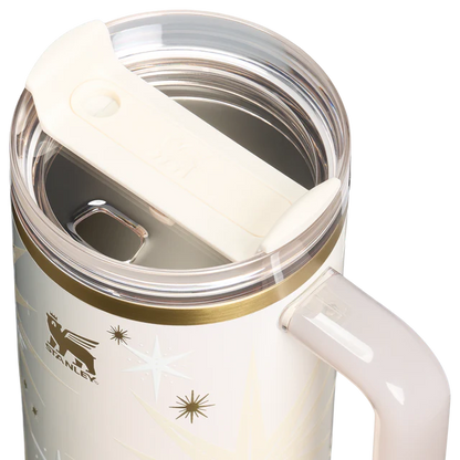 Stanley mug with handle and clear lid on a white background
