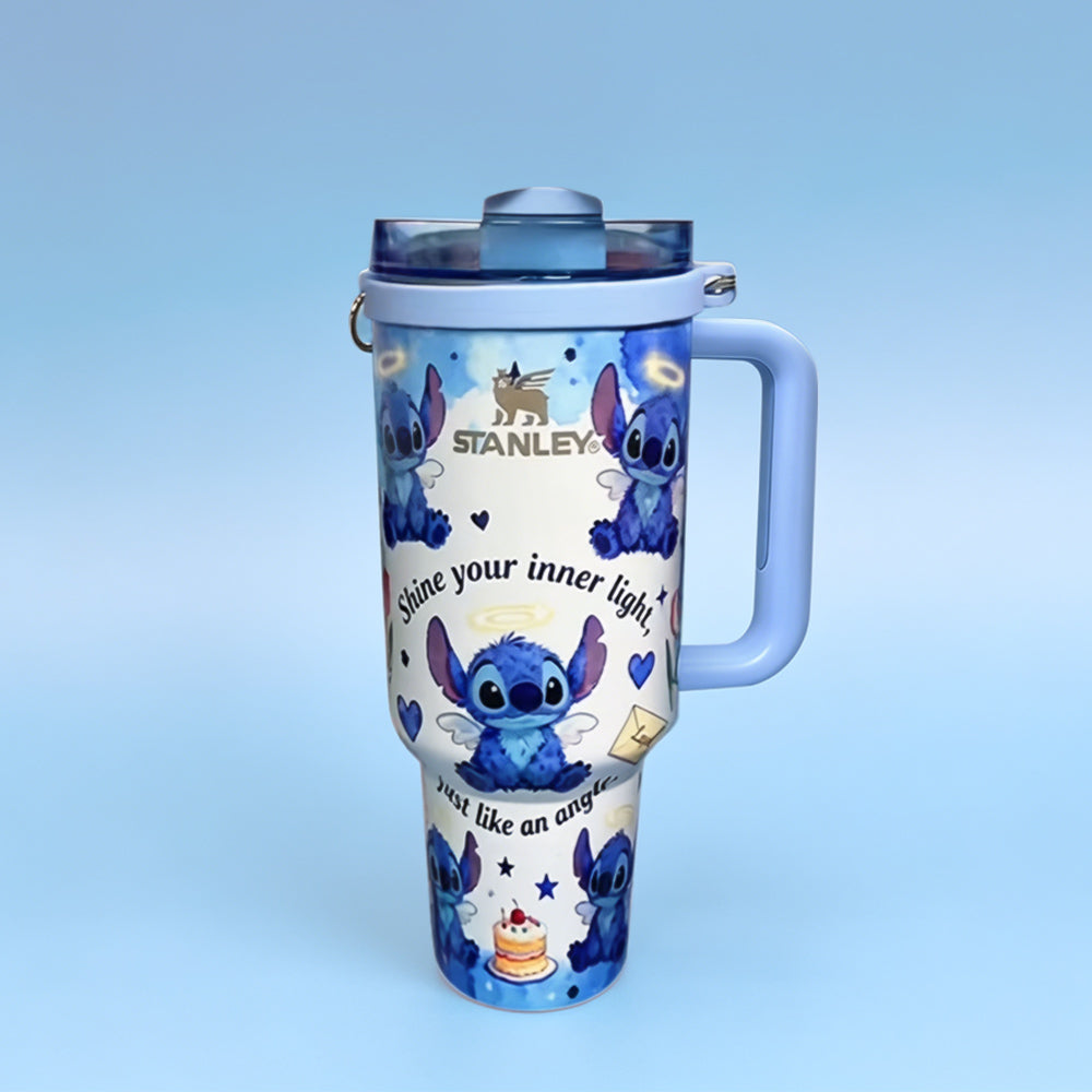 Stanley tumbler with cartoon character design on a light blue background