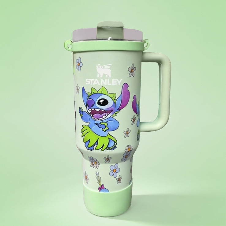 Stanley tumbler with cartoon character design on a light green background