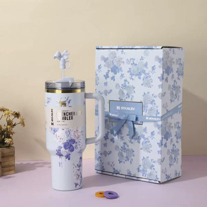 White and blue floral Stanley 40oz insulated tumbler with straw and matching gift box, elegant purple flowers design
