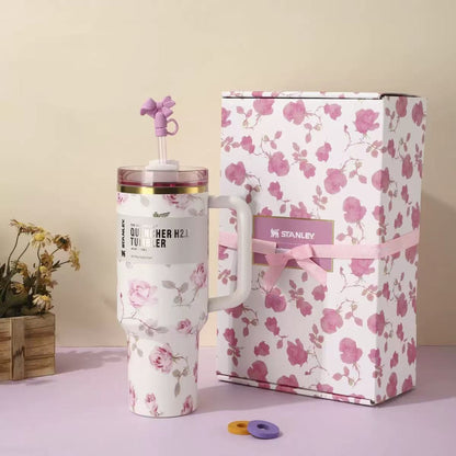 White and pink floral Stanley 40oz insulated tumbler with straw and matching gift box, pink ribbon design