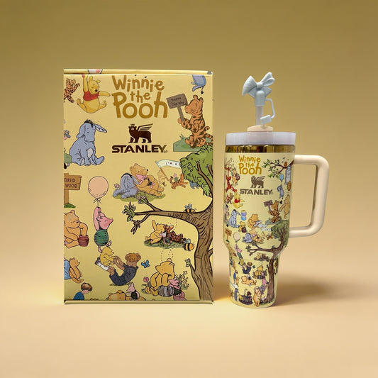 Stanley 40oz insulated tumbler featuring Winnie the Pooh and friends artwork, honey-inspired design, matching gift box and character straw topper