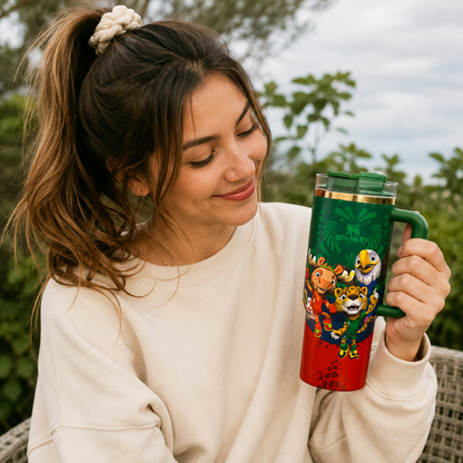 Woman holding a colorful mug with cartoon characters outdoors