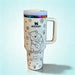 Stanley 40oz insulated tumbler featuring cute white bear illustrations, paw prints and floral accents